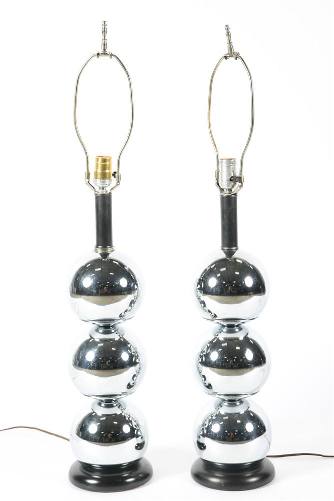 Style of George Kovacs, Pair of Lamps: Chromed metal. Height (including finial and harp): 34", Diameter: 6 1/2". Height (not including bulb, finial, or harp): 24". Style of George Kovacs, pair of bubble lamps. Three chromed metal bubbles m