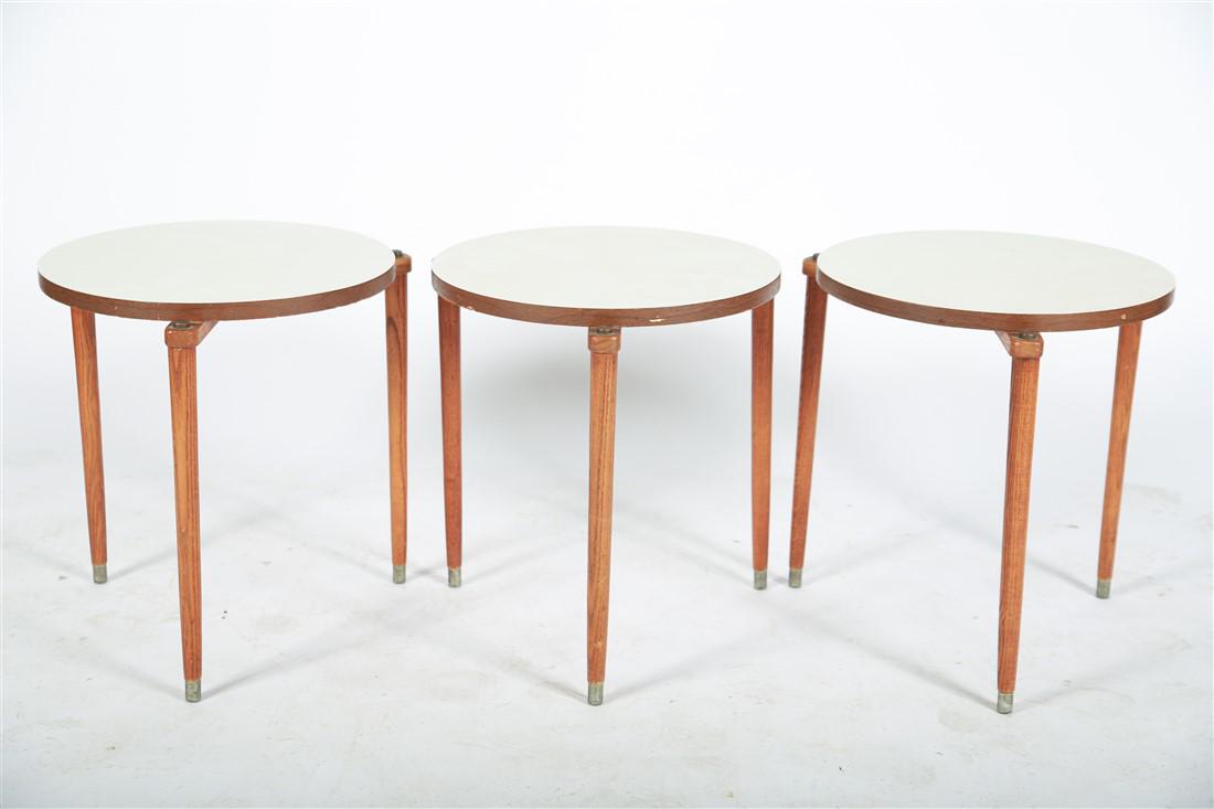 Mid-Century Modern Stacking Tables: Set of three mid-century modern stacking tables. Wood, brass, and laminate. Height: 17 3/4", Diameter: 17 1/4". Set of three mid-century modern nesting tables with wooden legs, white laminate plywood 