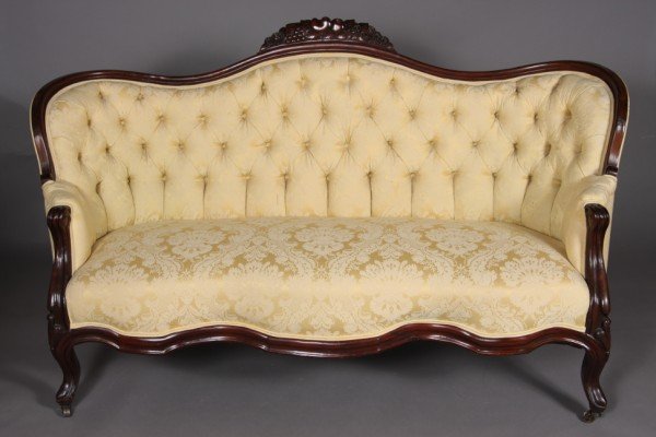 Victorian Mahogany Settee, 19th Century, 33" h.: Floral carved crest with yellow upholstery, on scrolled legs with floral carved knees.