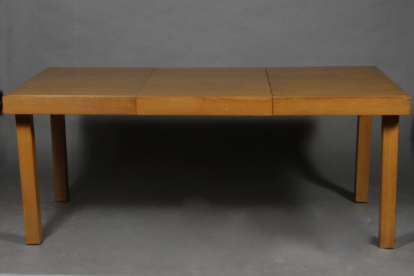 George Nelson Expandable Dining Table: Designed by George Nelson for Herman Miller, this vintage 1950's dining table has 2 hidden 20" leafs to expand from a nominal 72"x 42" table for 6-8 people to many more. Wood is primavera, and darkene