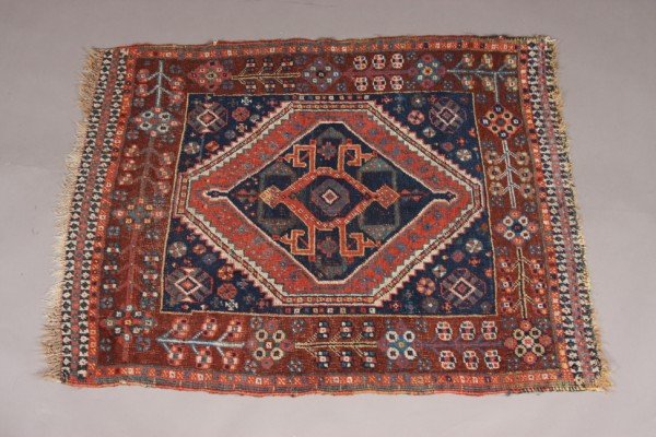 Caucasian Rug, Iran, Late 19th Century, 3' 8" x 2': Cobalt field with center rust diamond and geometric motif within a brown geometric border. Dimensions: 3' 8" x 2' 10" Condition: Nap Is Low And Worn.