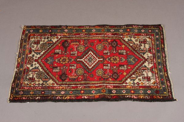 Caucasian Rug, Iranian, 20th C.,: Red field with ivory center, geometric motif with blue border. Dimensions: 46" x 28 1/2" Condition: Some Wear To Ends.