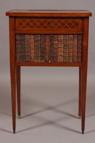 Louis XVI Parquetry Fruitwood Commode, French, Earl: French, early 20th century. Rectangular case with diamond pattern parquetry inlay. HInged top opening to fitted interior, over a drawer and a panel of faux leather book bindings, on square tapering le