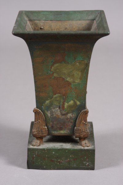 Tole Jardiniere, French, Late 19th Century, Green: French, late 19th century. Square flaring body with green painted finish. Raised on wing and lion paw feet. Height: 13 1/2" Condition: Paint appears to be later. One side has paint worn off, rust and