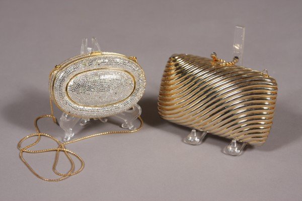 Judith Leiber Jeweled Hand Bag, with a Gilt Finish: Judith Leiber bag, American, 20th century. Oval form crystal encrusted and chain handle. Together with a gilt finished metal purse, Italian, 20th century. Former dimensions: L: 5". Condition: Jeweled 