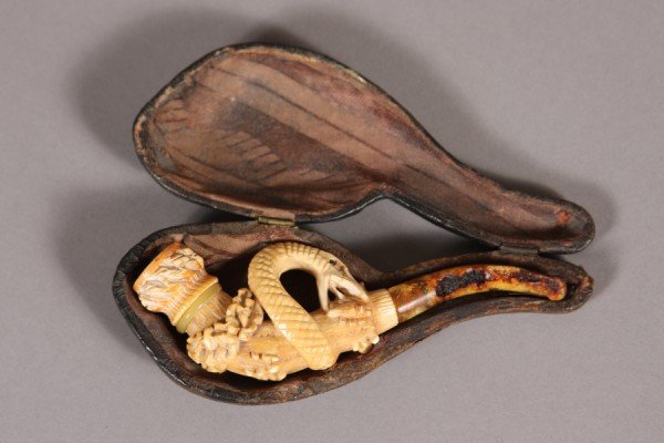 Pipe, Meerschaum, Snake on Branch, Carved, Case: Carved meerschaum pipe, Snake on Branch, with curving amber stem, with original fabric-lined, fitted case, 1875- 1900, 5" long. Condition: Good, amber stem with damage, case shows signs of age and use