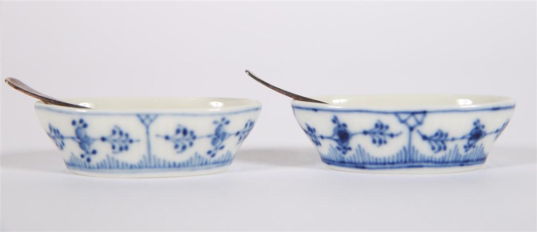 Royal Copenhagen, Blue Fluted Salt Dip Pair: Royal Copenhagen (Danish, est. 1755). "Blue Fluted Plain" pattern, c. 1969-1973. Designed by Arnold Krog. Model # 2128. Height: 3/4", Length: 2 3/4", Depth: 1 3/4". Spoon: Length: 2 1/2". Royal Copenh