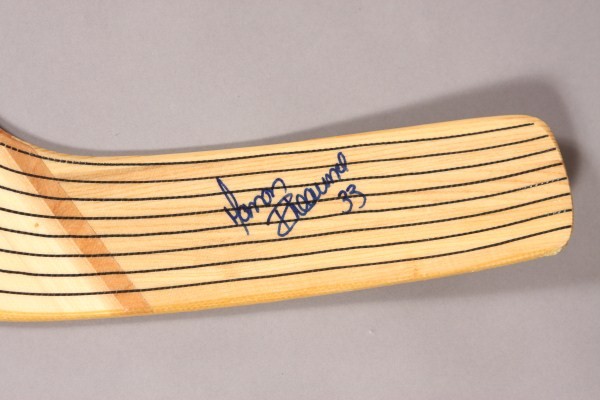 Manon Rheaume Autographed Bauer Goalie Stick: With photo of the item being signed.
