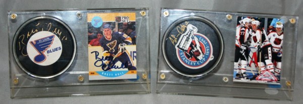 24 Autographed Hockey Items: Highlights include: Brett Hull (Puck and Card), Ed Belfour (Puck and 2 Cards), Denis Savard (Puck), Bobby Hull (Puck), and more.