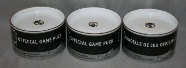 Three 2002 Stanley Cup Official Game Pucks: Condition: In cases.