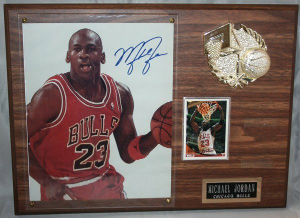 Michael Jordan Autographed Photo, With Card: 8 x 10 color photo autographed, framed with a Topps Gold Michael Jordan Card. Not taken out of the frame. Dimensions of plaque: 12" x 16".