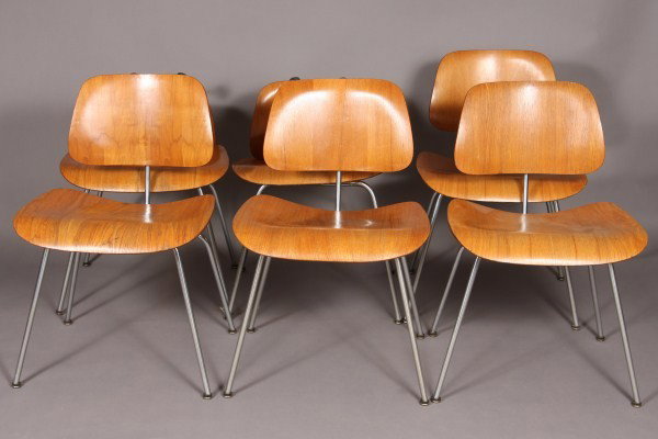 Set of Six Herman Miller Chrome and Molded Plywood: Designed by Charles Eames, American, 20th century. With shaped back and seat on splayed legs. Condition: Finish is worn. One seat and 1 back have been re-attached. One back needs to be re-attached.