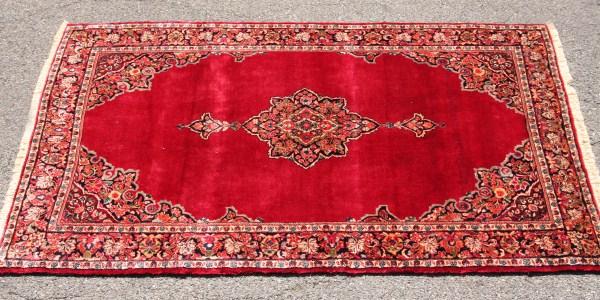 Muhal Rug, Iranian, 20th C. Sand, Red & Black Foli: Sand, red and black foliate border, surrounding and red field with center black, sand and blue medallion. Dimensions: 6' 7" x 4'. Condition: Fringe has been repaired.