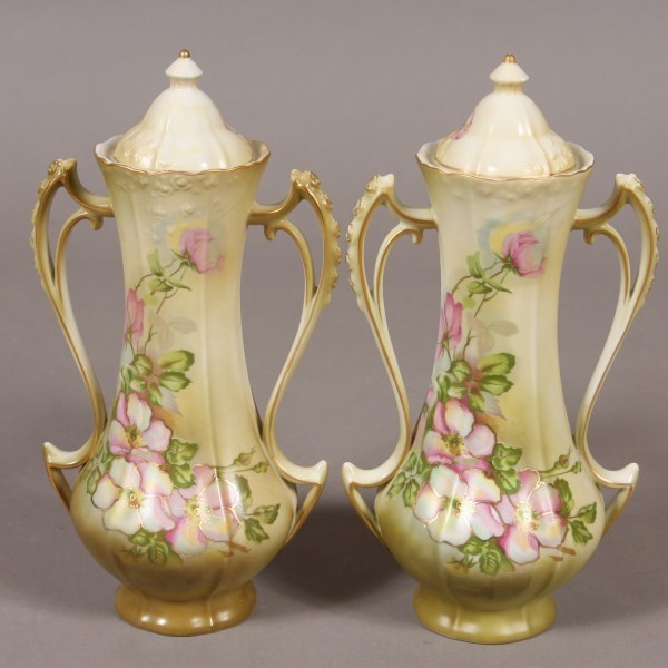 Pair Nippon Porcelain Covered Urns, Japanese, 20th: Decorated with floral blossoms. H 12". Condition: Appears fine.