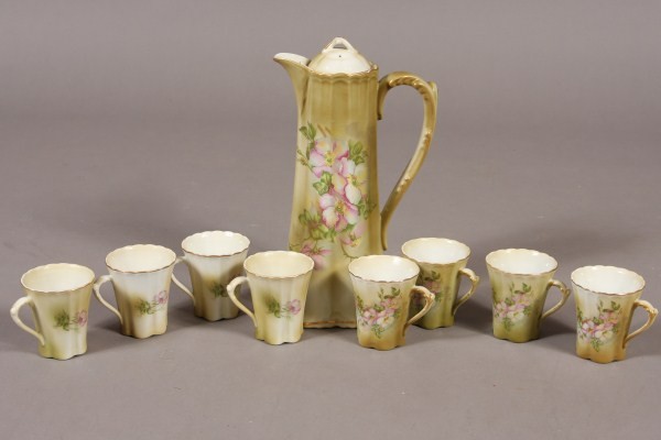 Nippon Porcelain Coffee Pot, Japanese, 20th Centur: Together with eight coffee cups, decorated with floral blossoms. Dimensions: Pot H 11 1/2". Condition: Appears fine.