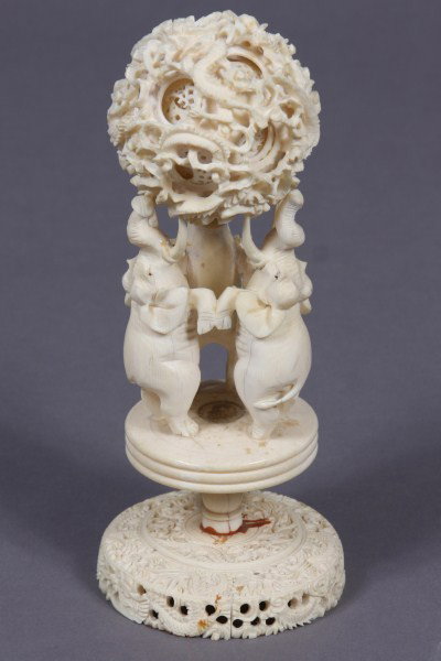 Carved Ivory Puzzle Ball, Indian or Chinese, H 8": Condition: The base is cracked in Two (2) places. Pedestal is re attached to the base. Elephant tusk is broken. Please note ivory cannot be shipped outside of the U.S.