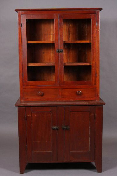 Country Cherry & Walnut Step Back Cupboard, America: Late 19th century. The upper case with pair of glazed doors over small drawers over lower case with pair of cupboard doors. Dimensions: H 72 1/2"; W 39"; D 19 1/2". Condition: The upper and lower case