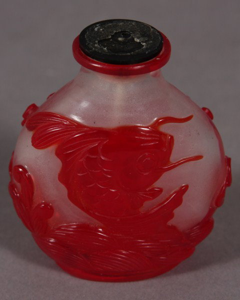 Peking Red & Opaline Glass Snuff Bottle, Chinese,: Chinese, 20th Century; Carved with Fish; H: 2 1/2"; Condition: Missing the Stopper.