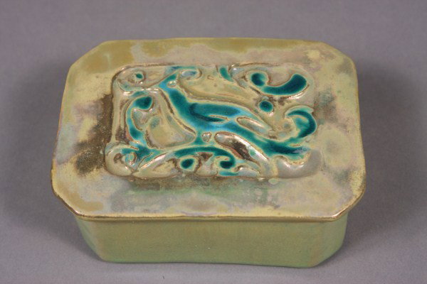 Pewabic Pottery Gold Luster Glazed Rectangular Box: American, 20th century. The top incised with a bird, marked. 5" x 3 3/4". Condition: Appears fine.