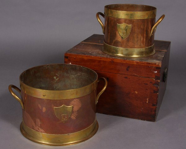 Set of Five Copper and Brass Bound Measures: Set of Five Copper and Brass Bound Measures. W.O. Hickok, Harrisburg. From half pint to half bushel. In Two (2) fitted Cherry boxes. Condition: The set missing One (1) measure. The boxes are distresse