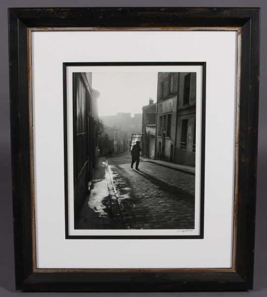 Willy Ronis "Glazier in Menilmontant": Willy Ronis (French, 1910-2009) "Glazier in Menilmontant" Gelatin Silver Print. 1948. Signed lower right. Image size 17" x 13". Condition: Appears fine.