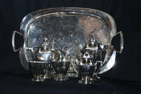 Sterling Silver Tea & Coffee Service, Mexican: Sterling Silver Tea & Coffee Service. Mexican, 20th c. WIth tea pot, coffee pot, waste bowl, and rectangular tray. Covered sugar and creamer not included. Coffee pot H: 10", Tray L: 24 5/8". 158