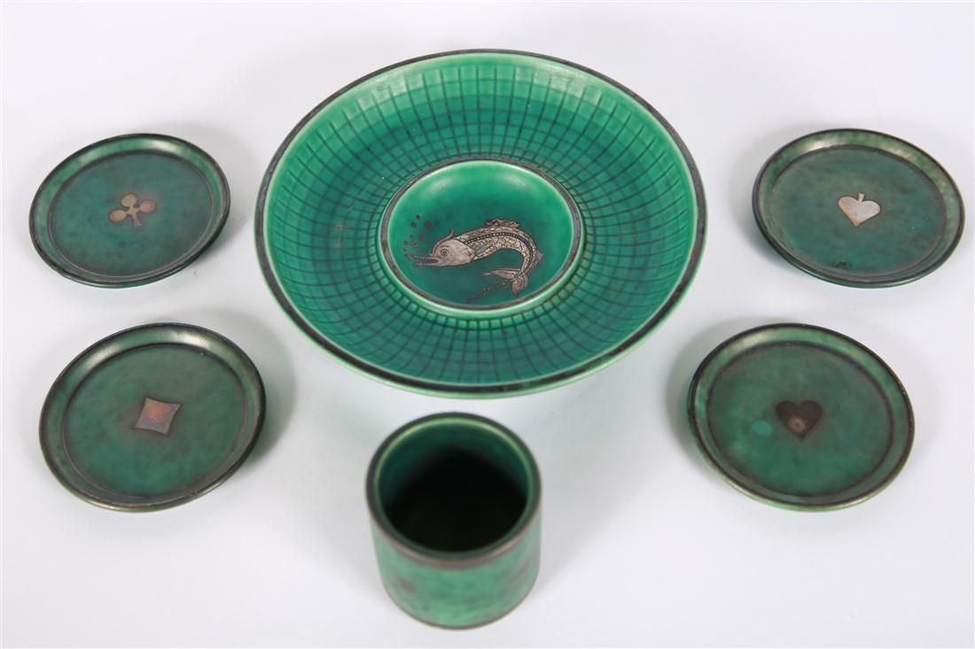 Wilhelm Kage for Gustavsberg, Silver Inlay Pottery: Wilhelm Kage (Swedish, 1889-1960). Glazed pottery with silver inlay. Designed for Gustavsberg Sweden. Fish bowl: Height: 1 3/4", Diameter: 7 1/2". Cigarette holder: Height: 2 1/4", Diameter: 2 1/2". A