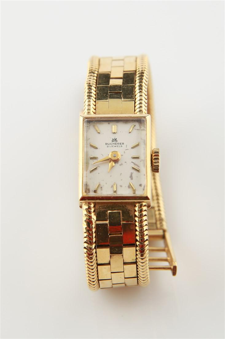 Bucherer, 18k Lady's Bracelet Style Watch: Bucherer, lady's bracelet style wristwatch made of 18k yellow gold. Piece measures 7" long and weights 37.2g with works. 18k braided patchwork bracelet. 18k flip lock clasp stamped "18k CB". 21 jewel