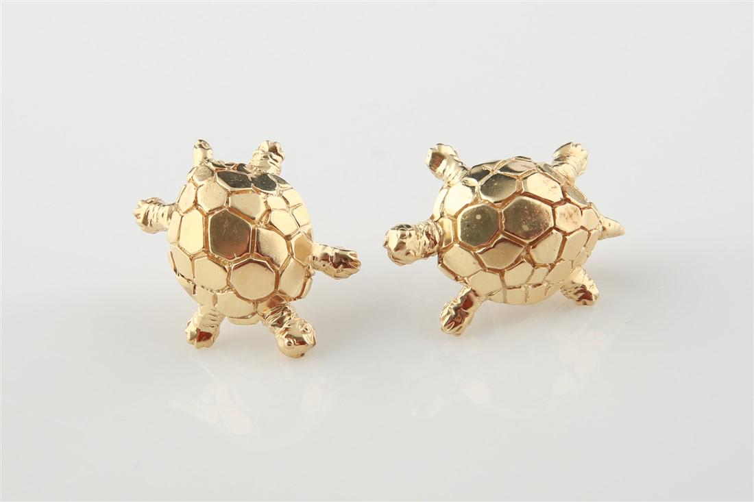 14k Yellow Gold Turtle Earrings: Pair of turtle earrings made of 14k yellow gold. Earrings are made up of pierced omega style backs, are stamped 585, and weigh 10.2g.