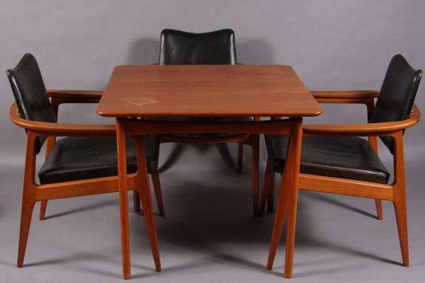 Mid-Century Walnut Table with Four Chairs, Danish: Mid-Century walnut table with four chairs. Danish, 20th Century. Made by John Stuart, Inc. The chairs with black leather upholstered seat and back cushion. Table H: 29", W: 33", D: 32". Condition: The