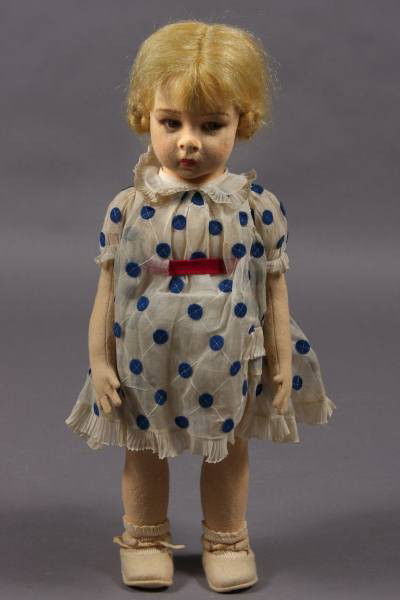 Lenci Felt Shirley Temple Doll, Italian, 20th C.: Lenci felt Shirley Temple doll. Italian, 20th Century. With brown eyes and felt clothes. H: 22". Signed on the bottom of one foot. Condition: Face is slightly discolored. Shoe laces are broken.