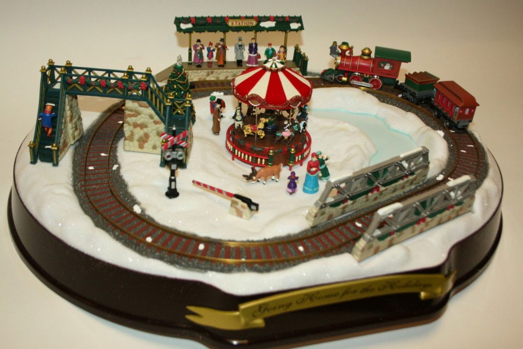 Mr. Christmas "Going Home for The Holidays" Musica: Mr. Christmas "Going Home for The Holidays" Musical Train Set, New in Box. #296B. Condition: Appears fine.