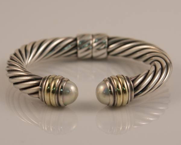 Bracelet, David Yurman. Sterling Silver & 14K Gold: Bracelet, David Yurman. Sterling Silver cable and 14K Yellow Gold with Pearls. Signed "(C) D YURMAN". D: 3", L: 7 3/4", 10mm. From the "Throughbred" collection. 1.465 troy ounces. 45.5 grams.