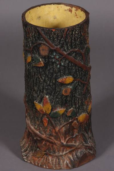 Arts and Crafts Painted Terra Cotta Umbrella Stand: Arts and Crafts painted terra cotta umbrella stand. 20th Century. In the form of a tree trunk. H: 21". Condition: The painted finish is worn in several places.