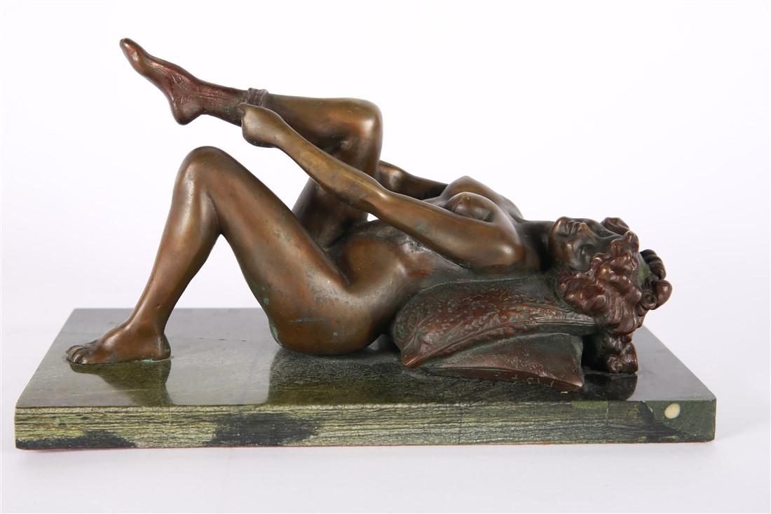 Bronze Statue of Woman Putting on a Stocking: Bronze, marble. Measurements including base: Height: 6", Length: 11 1/4", Depth: 5 3/4". Bronze statue of a woman putting on a stocking. Underside of pillow appears to be marked "T. Chale" or similar.