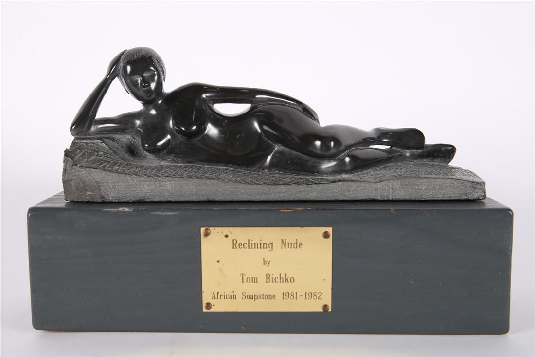 Thomas Bichko, "Reclining Nude" African Soapstone: Thomas Bichko (American, 20th century). "Reclining Nude". African soapstone, 1981-1982. Sculpture: Height: 4 1/2", Length: 10 1/2", Depth: 3 1/4". Base: Height: 3", Length: 11 1/4", Depth: 4 1/2". Car