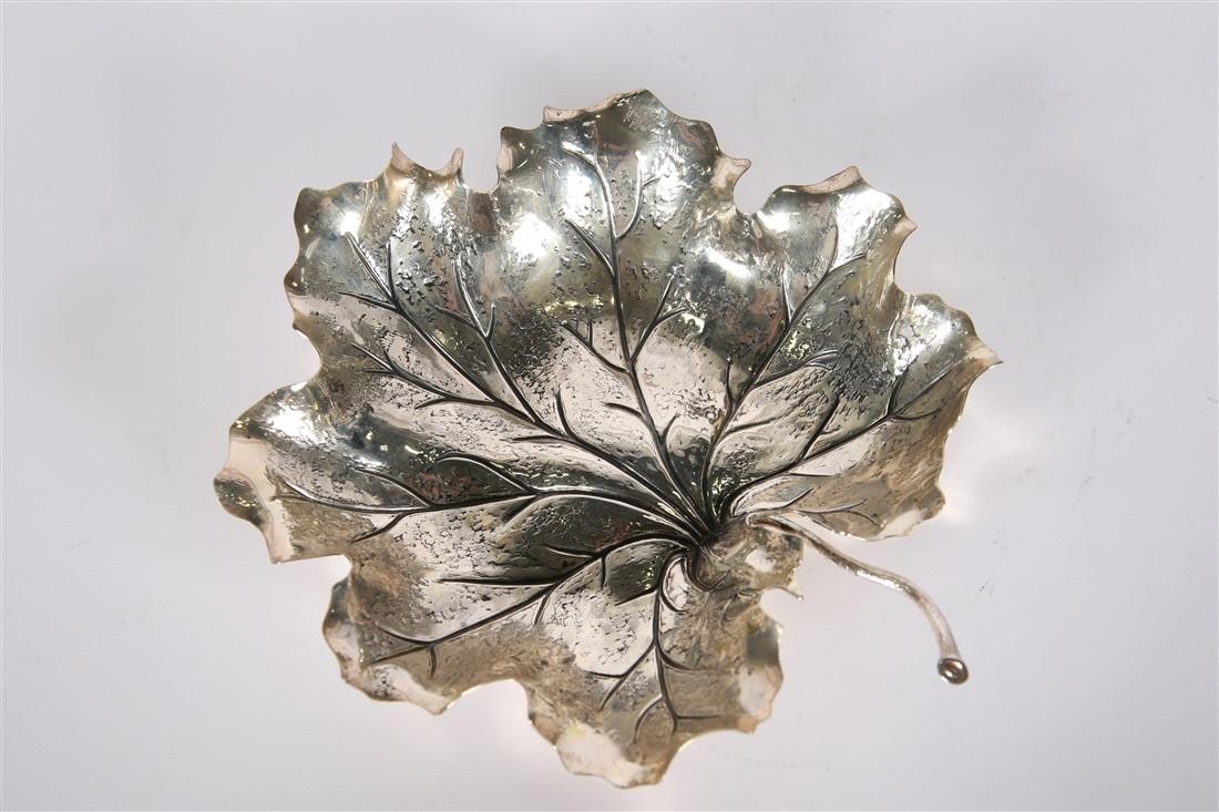 Buccellati, Sterling Silver Leaf Dish: Buccellati. Sterling silver. Height: 2", Length: 8 3/4", Depth: 9 1/2". Weight: 11.75 ozt. Sterling silver leaf form dish by Buccellati. Stamped to the underside "Buccellati Sterling Italy". Comes wit