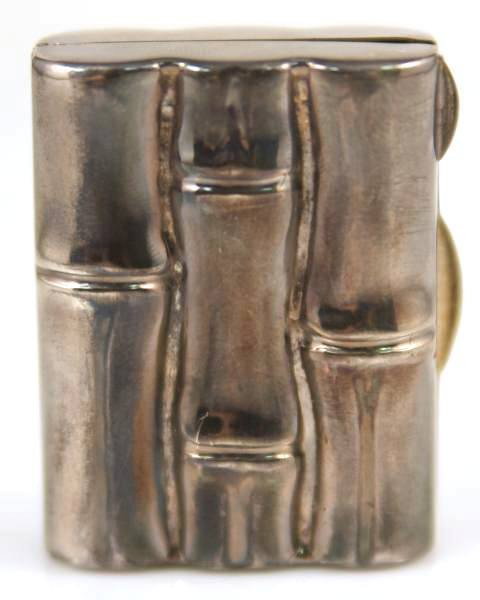 Tiffany & Company Sterling Silver Bamboo Pill Box: Sterling silver bamboo pill box, made by Tiffany. Height 1/2", width 1 1/4", depth 1 5/8". Inside lip marked "Tiffany &Co", "Italy", "sterling", and "925".