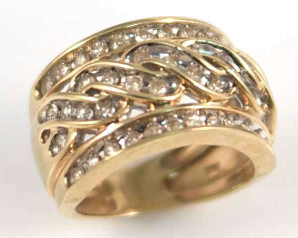 Ladies Ring, 10K Yellow Gold and Diamond Band Ring: Ladies band ring made of 10k yellow gold and diamonds. Band width 1/2". Size 5 1/2". 7.5 grams total weight.