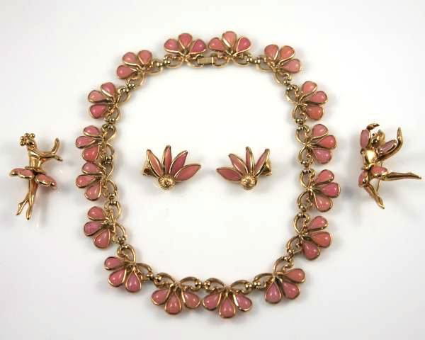 Vintage Crown Trifari Pink Poured Glass Set: Crown Trifari set including earrings, necklace, and two broaches. Made of pink poured glass set in yellow gold tone metal. Earrings length 1". Necklace 15", marked "Trifari". Broaches, two dancers, a