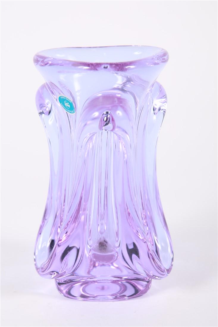 Czech Republic Purple Melt Vase: Glass. Height: 7 1/2", Diameter: 4 1/2". Bright purple/lilac translucent glass with melt forms around the exterior. Sticker to the exterior, signed initials to underside.
