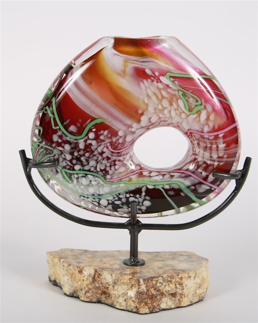 Homer James Yarrito, Blown Glass Vase: Homer James Yarrito (American). Glass, stand. Vase: Height: 6 1/2", Length: 7 3/4", Depth: 1 1/2". Stand: Height: 5 3/4", Length: 9", Depth: 3". Blown glass vase with stand by Toledo, Ohio glass artis