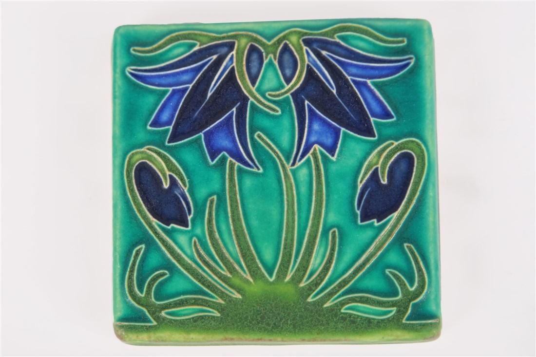 Motawi, "Ladybell" Floral Tile: Motawi Tileworks (American, established 1992). "Ladybell". Ceramic tile. 4" x 4". Motawi tile with blue and green glazed ladybell flower. Impressed to the underside "Motawi Tile Works Ann Arbor MI".