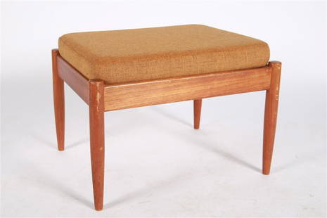 Povl Dinesen Teak Foot Stool: Teak. Distributed by Povl Dinesen Cabinetmaker. Height: 16", Length: 23", Depth: 18 1/2". Teak foot stool distributed by Povl Dinesen Cabinetmaker. Silver Povl Dinesen sticker to the underside. Brown