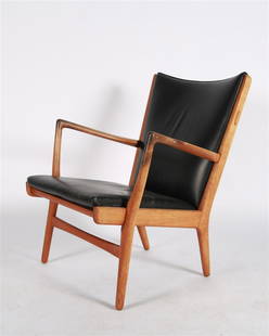 Hans Wegner, AP16 Black Leather Chair: Hans J. Wegner (Danish, 1914-2007). AP-16 chair. Teak, leather. AP Stolen. Height: 32 1/2", Length: 27 1/2", Depth: 30". Black leather upholstered teak armchair designed by Hans J. Wegner. Appears