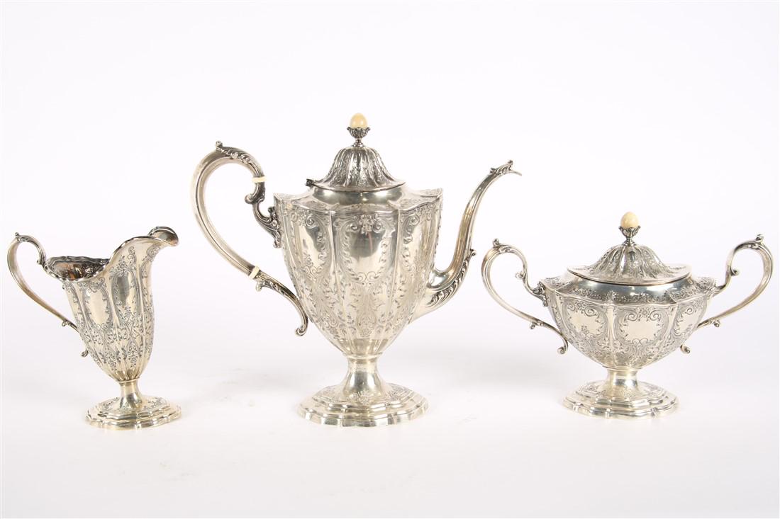 Durgin (American), Three-Piece Sterling Tea Set: William B. Durgin Co. (American, 1853-1924). Sterling silver tea set. Kettle: Height: 10 1/2", Length: 11 1/2", Depth: 5". Creamer: Height: 6 5/8", Length: 6", Depth: 2 3/4". Sugar bowl: Height: 7 1/4