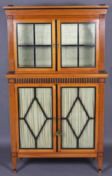 Biedermeier Birch and Ebony Finished Cabinet: Biedermeier birch and ebony finished cabinet. Continental, first quarter 20th century. Height 63", width 37", depth 16". Condition: Minor wear to the ebony finish. Appears that it had finials which ar