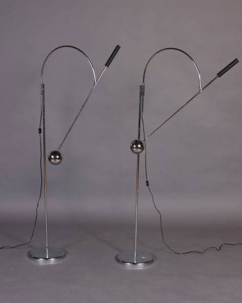 Pair Robert Sonneman Chrome Standing Floor Lamps: Pair contemporary chrome standing adjustable floor lamps. American, 20th century. Designed by Robert Sonneman. Height 58". Condition: The chrome finish is worn.