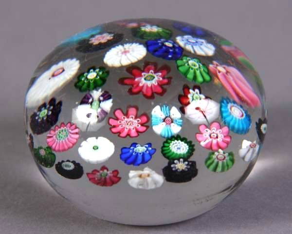 Blown Glass Paperweight, Probably Baccarat, 20th C.: Blown glass paperweight. Probably Baccarat. French, 20th century. With caned floral motif. Diameter 3 ¼".