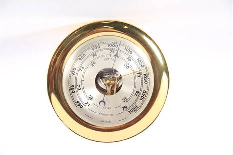 Chelsea Clock Co., Brass Barometer: Chelsea Clock Company (American, established 1897). Brass, metal. Diameter: 7 1/2", Depth: 3 3/4". Chelsea Clock Co. brass ship's barometer. Face marked "Chelsea" and with measurements for inches,